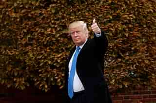 President-elect Donald Trump waves as he arrives at Trump International Golf Club for a day of meetings in Bedminster Township, New Jersey. (Drew Angerer/Getty Images)