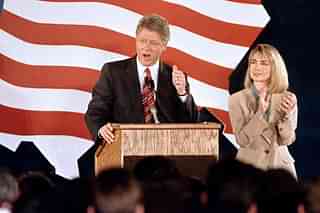 Democratic Presidential Bill Clinton (L) addresses supporters on 2 June 1992 in Los Angeles as Hillary applauds. (MIKE NELSON/AFP/Getty Images)