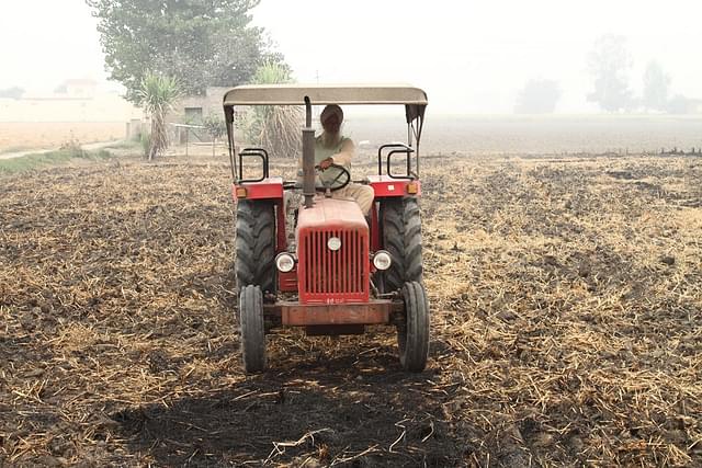 A farmer ploughing in evidence of paddy straw burnt in fields at Noorpur Bet village in Ludhiana. Photo by Vivian Fernandes on 1 November, 2016.