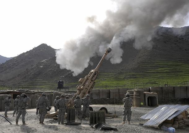 US soldiers fire shots using an M-777 howitzer. Photo credit: LIU JIN/AFP/GettyImages