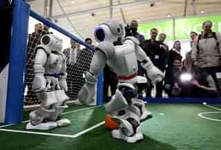 Robots play football in a demonstration of artificial intelligence at the stand of the German Research Center for Artificial Intelligence. (Photo by Sean Gallup/GettyImages)