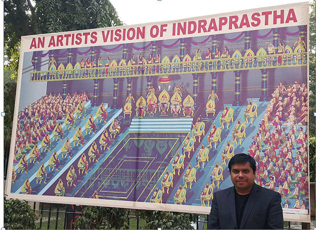 Jijith Nadumuri Ravi with his painting depicting Yudhisthira
seated on the throne flanked by his brothers.&nbsp;