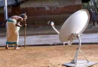 An elderly woman walks past a direct to home (DTH) dish antenna
installed outside a village home at Binpur, some 260 kms, south west of
Kolkata. (DESHAKALYAN CHOWDHURY/AFP/GettyImages)