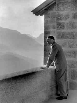 Adolf Hitler looking at the Obersalzberg Mountains from a balcony of his Berghof residence near Berchtesgaden. (Photo credit - /AFP/Getty Images)