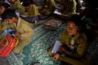 
A schoolgirl 
sits in a classroom. (Chandan Khanna/AFP/GettyImages)


