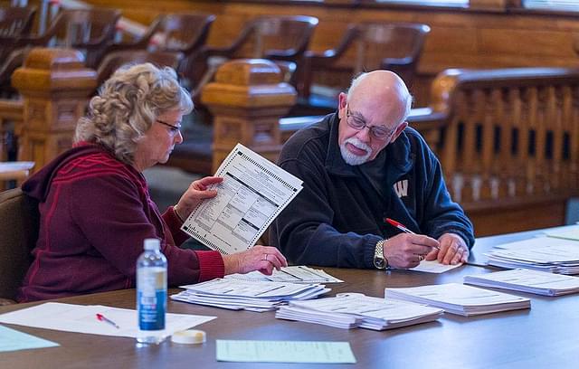 Tabulators count ballots on the presidential recount at the Green County Courthouse in Monroe, Wisconsin. (Andy Manis/Getty Images)