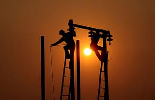 Electric cables being hung (Sanjay Kanojia/AFP/Getty Images)&nbsp;