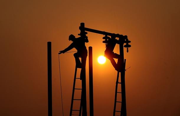 Electric cables being hung (Sanjay Kanojia/AFP/Getty Images) 