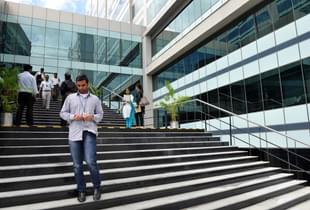 An employee of Wipro, India’s third largest software company, walks down the stairs at the campus of the software giant in Bangalore. (Manjunath Kiran/AFP/GettyImages)