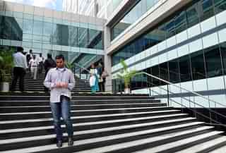 

An employee of Wipro, India’s third largest software company, walks down the stairs at the campus of the software giant in Bangalore. (Manjunath Kiran/AFP/GettyImages)