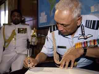 Tyagi signs the guest’s book at the Sri Lankan navy
headquarters in Colombo. (SANKA VIDANAGAMA/AFP/GettyImages)
