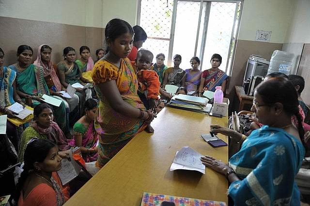 Pregnant women wait to meet a doctor for their regular medical checkup at a Government Maternity Hospital. (NOAH SEELAM/AFP/Getty Images)