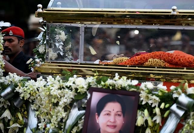 

The mortal remains of Jayalalithaa are carried during a procession to her burial place in Chennai. (ARUN SANKAR/AFP/GettyImages)