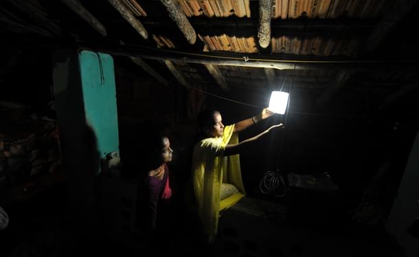 Villagers switch on a light in Morabandar, Elephanta Island, off the coast of Mumbai. (SAJJAD HUSSAIN/AFP/Getty Images) 