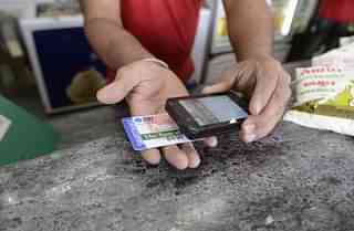 A customer uses an SBI Card. (SAM PANTHAKY/AFP/Getty Images)
