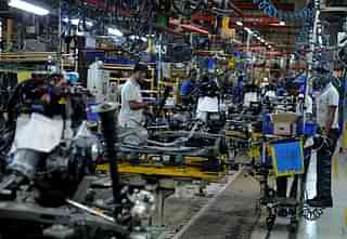 Factory workers at the
assembly lines of components for Datsun Go and Renault Kwid vehicles at Renault
Nissan Automotive India factory in Chennai.&nbsp;