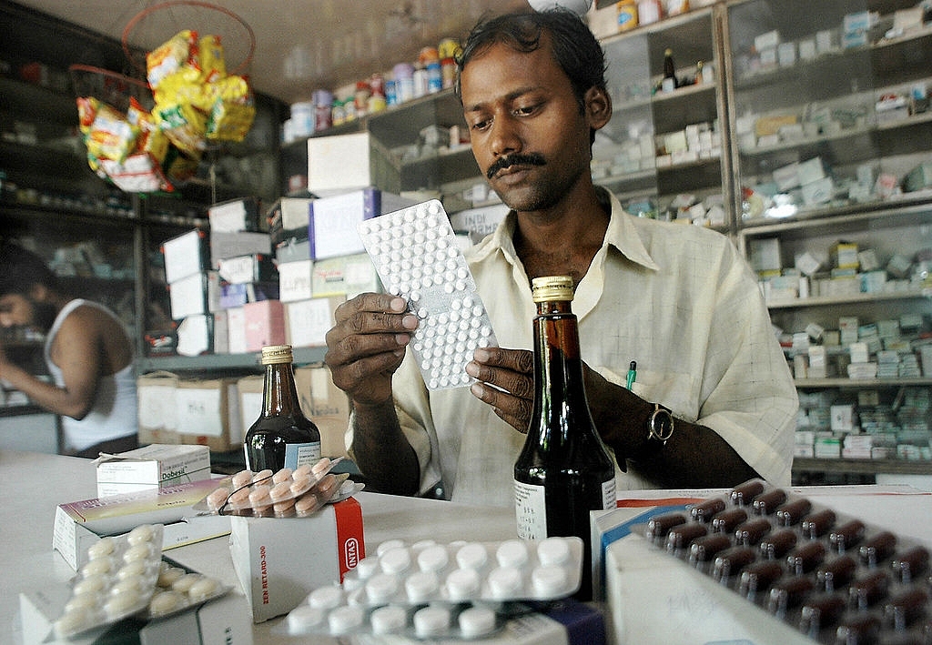 An Indian pharmacy shop assistant counts a strip of tablets. (Representative image) Photo credit: DESHAKALYAN CHOWDHURY/AFP/Getty Images