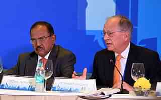 
Ajit Kumar Doval (L) listens as 
Wolfgang Ischinger delivers his 
speech. (PRAKASH SINGH/AFP/Getty Images)

