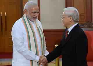 
Prime Minister Narendra Modi (L) shakes hands with 
Vietnam’s Communist Party Secretary General Nguyen Phu Trong. (HOANG DINH 
NAM/AFP/GettyImages