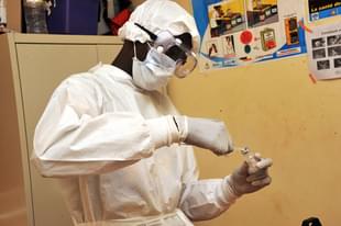 A health worker prepares a vaccination at a health centre during the first clinical trials of the VSV-EBOV vaccine against the Ebola virus. (CELLOU BINANI/AFP/Getty Images)
