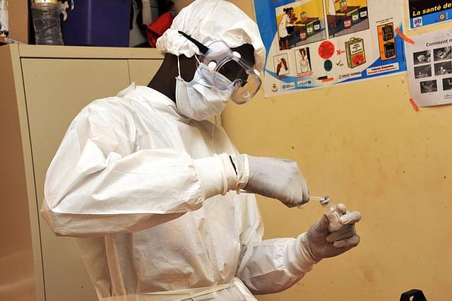 A health worker prepares a vaccination at a health centre during the first clinical trials of the VSV-EBOV vaccine against the Ebola virus. (CELLOU BINANI/AFP/Getty Images)