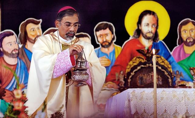 

Archbishop Patriarch Reverend Filipe Neri Ferrao at a religious service (SEBASTIAN D’SOUZA/AFP/Getty Images)