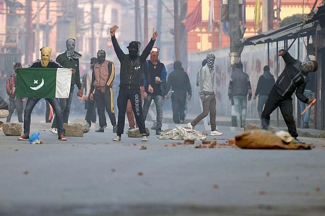 
Kashmiri protestors clash with local police in 
downtown Srinagar. (TAUSEEF MUSTAFA/AFP/Getty Images)

