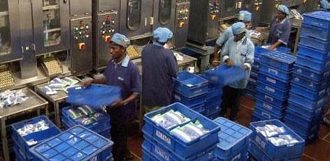 Workers at an Aavin distribution section