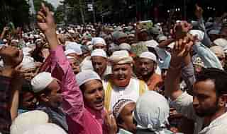 Muslims shout slogans against the central government after offering special prayers the day after the execution of convicted bomb plotter Yakub Memon in Kolkata (DIBYANGSHU SARKAR/AFP/GettyImages)