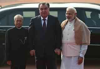 
President of the Republic of Tajikistan Emomali Rahmon (C) shakes 
hands with India Narendra Modi and Pranab Mukherjee (PRAKASH SINGH/AFP/Getty Images)

