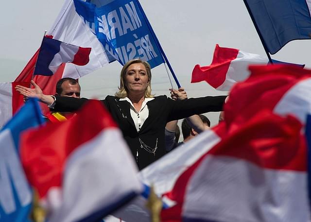 Marine Le Pen gestures as she delivers a speech during the French Far Right Party May Day demonstration in Paris, France. (Pascal Le Segretain/Getty Images)