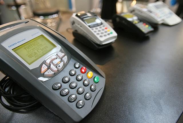 Card payment terminals are on display digital IT and telecommunications fair. (JOHN MACDOUGALL/AFP/GettyImages)
