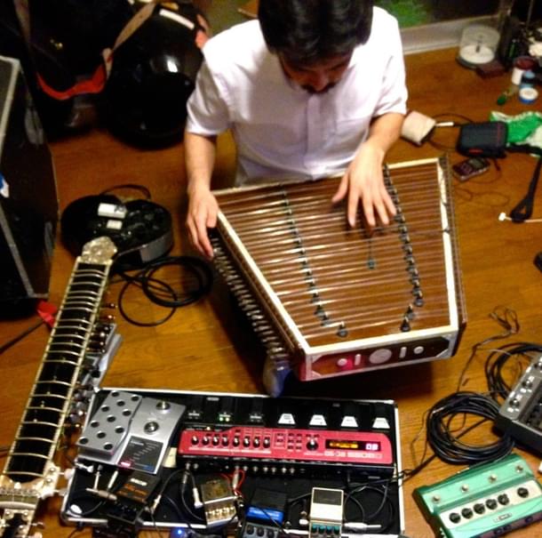 Strings and silence: The author tuning his santoor.