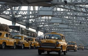 Indian commuters and taxi drivers navigate through heavy traffic on Howrah Bridge in Kolkata. (DIBYANGSHU SARKAR/AFP/Getty Images)