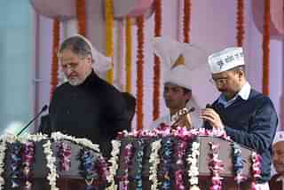 Kejriwal and Jung during the former’s swearing-in ceremony in New Delhi. (PRAKASH SINGH/AFP/GettyImages)