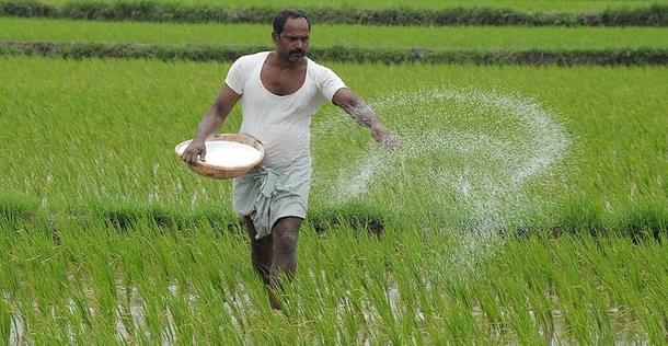 A farmer fertilises his field. (GettyImages)