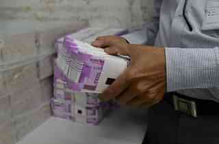 Stacks of new Rs 2,000 notes (SAM PANTHAKY/AFP/Getty Images)