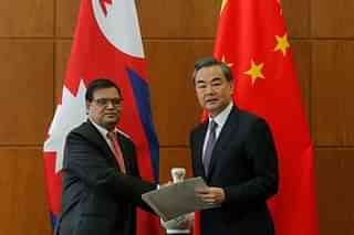 
Krishna Bahadur Mahara (L), Special Envoy for Nepal’s Premier, 
speaks to Chinese Foreign Minister Wang Yi. (WU HONG/AFP/GettyImages)

