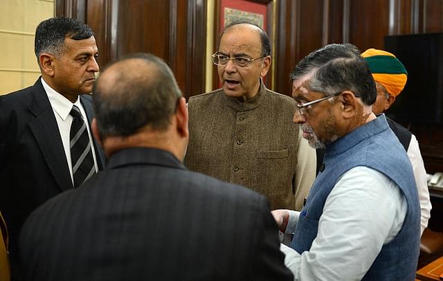 Union Finance Minister Arun Jaitley (C) speaks with members of his team the day before presenting the Union Budget 2017-2018. (SAJJAD HUSSAIN/AFP/Getty Images)