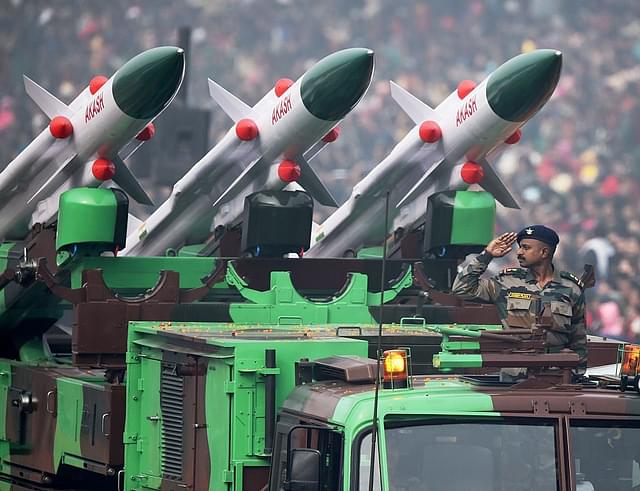 An Indian soldier salutes as he rides an Akash weapon system of air defence during India’s Republic Day parade in New Delhi. (ROBERTO SCHMIDT/AFP/Getty Images)