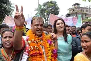 Sarma, accompanied by supporters, is on his way to file nomination papers from Jalukbari Assembly Constituency in Guwahati. (BIJU BORO/AFP/GettyImages)