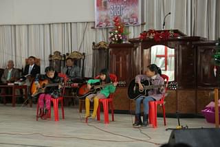 Children singing Christmas carols at the Church (Rajkumar Mixn)