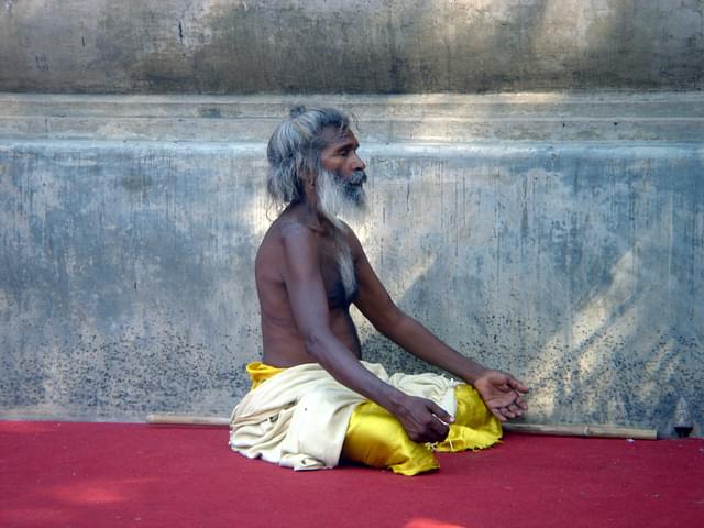A holy man in meditation near Mahabodhi Temple, Bodh Gaya, India (Wise Droid/Wikimedia Commons)