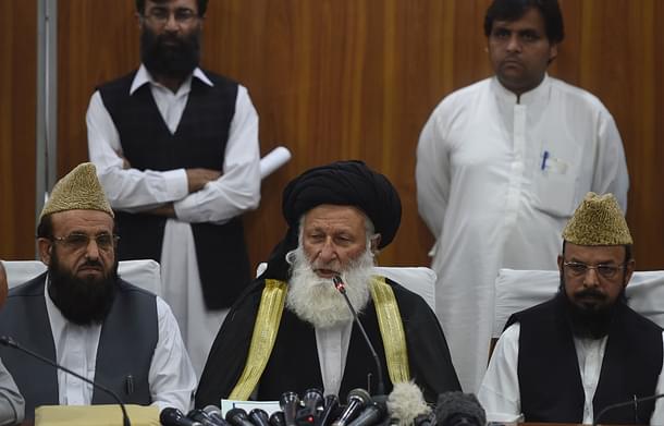Council of Islamic Ideology (CII) chairman Maulana Muhammad Khan Sherani (C) addresses a press conference in Islamabad. (FAROOQ NAEEM/AFP/Getty Images)