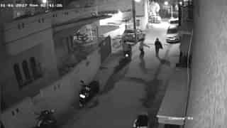 
							Two men on a scooter assault a woman in Bengaluru, 
India, in this still image taken on 1 January 2017 CCTV footage. 
							(Reuters)
							

