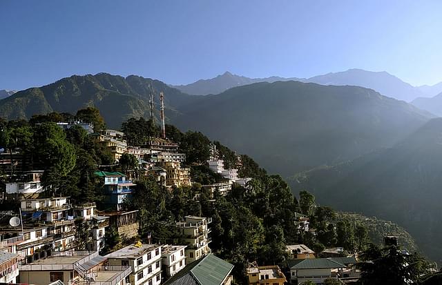A view of the Dharamshala town is seen amidst the Dhauladhar range of mountains from the Namgyal Monastry. (Manjunath Kiran/AFP/Getty Images)