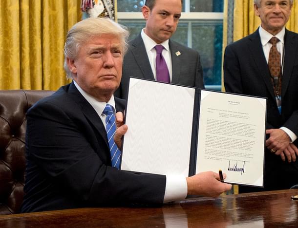 President Donald
Trump shows the Order withdrawing TPP. (Ron Sachs - Pool/Getty Images)