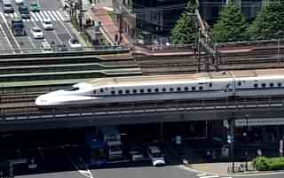 

A Shinkansen bullet train goes over a street in Tokyo. (Photo credit: TORU YAMANAKA/AFP/Getty Images)
