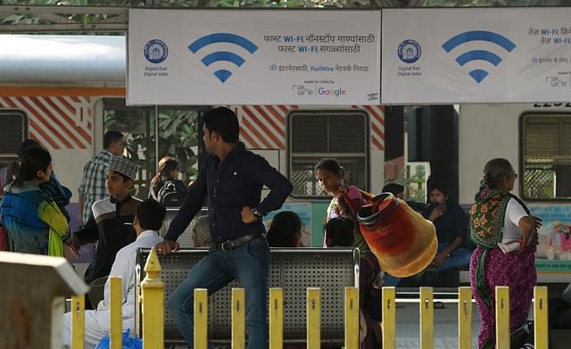 Advertisements at a Railway Station in Mumbai (Photo Credit: PUNIT PARANJPE/AFP/Getty Images)