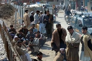 Pakistani labourers gather outside the overseas employment consultant office during the skill test to apply for a job at a Saudi construction company, in Rawalpindi. (FAROOQ NAEEM/AFP/Getty Images)